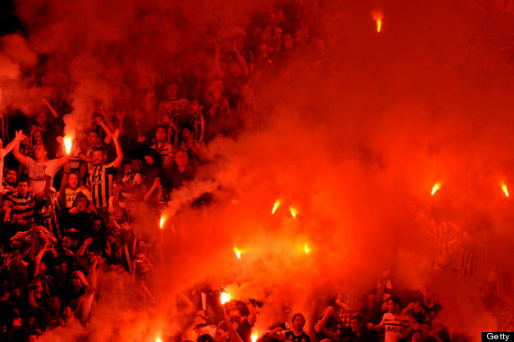 Fenerbahce's supporters celebrate their team's victory at the end of the Turkish Super League football match between Fenerbahce and Galatasaray, at Sukru Saracoglu stadium in Istanbul, on on May 12, 2013. AFP PHOTO / OZAN KOSE        (Photo credit should read OZAN KOSE/AFP/Getty Images)